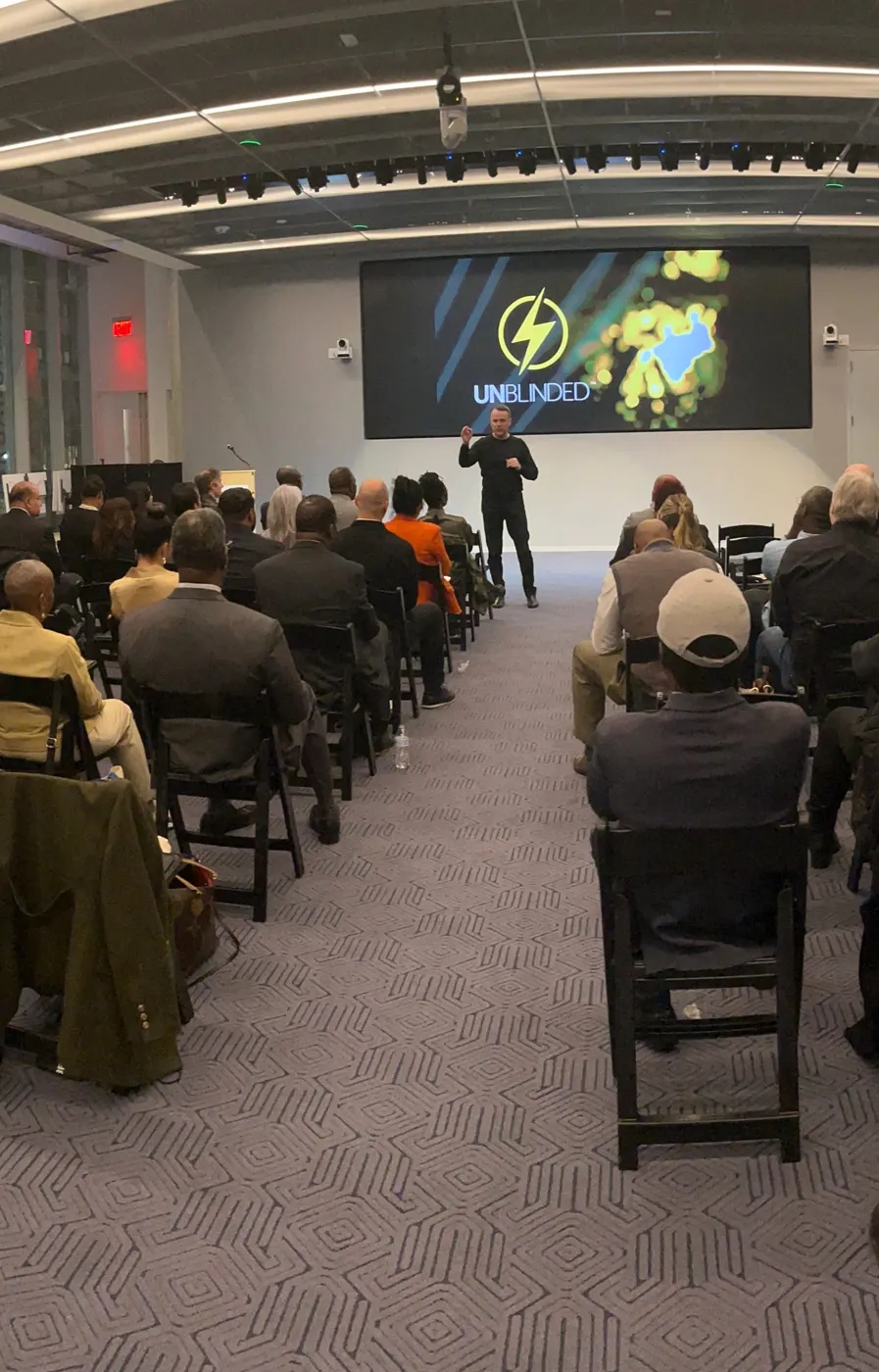 Sean Callagy teaching a full room at a past event